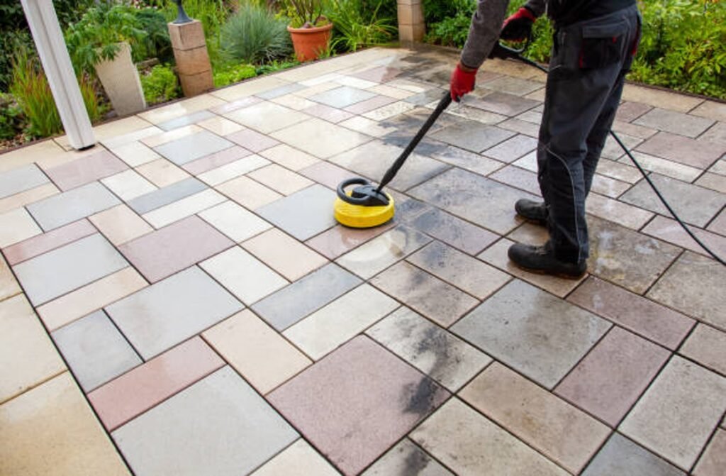 Cleaning and sealing decorative stamped concrete patio surface in residential backyard in Columbia Station, OH